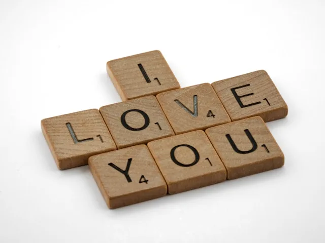 scrabble, scrabble pieces, lettering, letters, wood, scrabble tiles, white background, words, type, typography, design, layout, i love you, love you, 3 small words, love, heart, i heart you, i heart u,